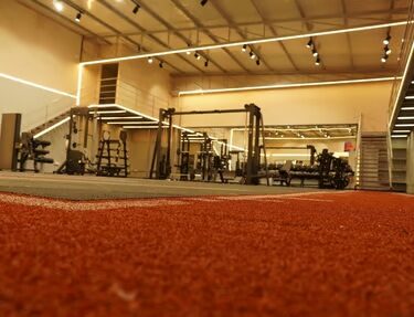 Indoor red running track inside Lite Weight gym